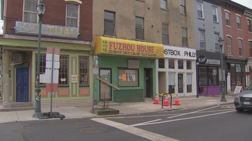 Police are investigating after a man's body was found in a shallow grave in the basement of an abandoned Chinese restaurant on South Street on Wednesday night.